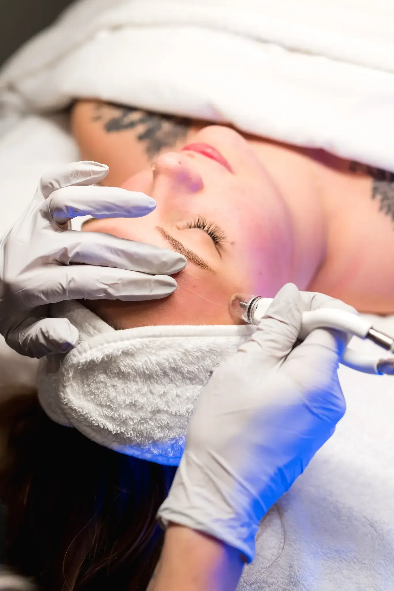 Microneedling treatment with LED wand at Banyan & Bamboo in Austin