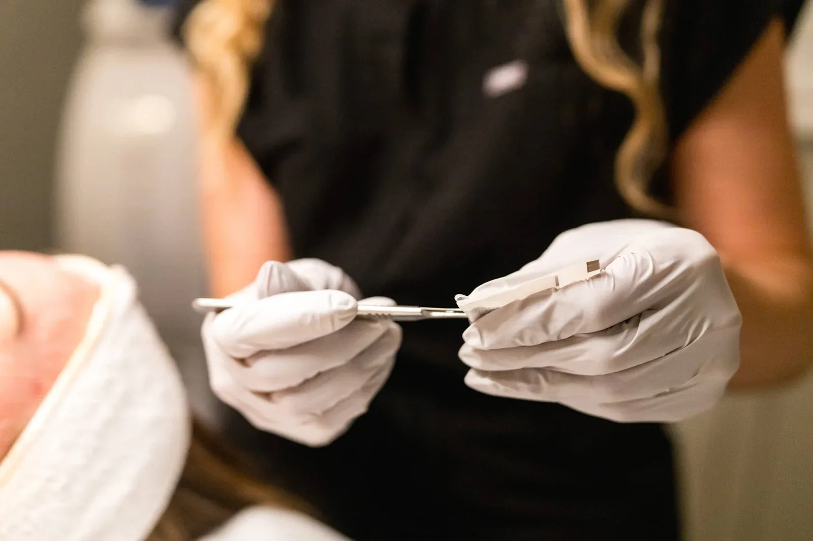 Provider performing dermaplaning at Banyan & Bamboo in Austin