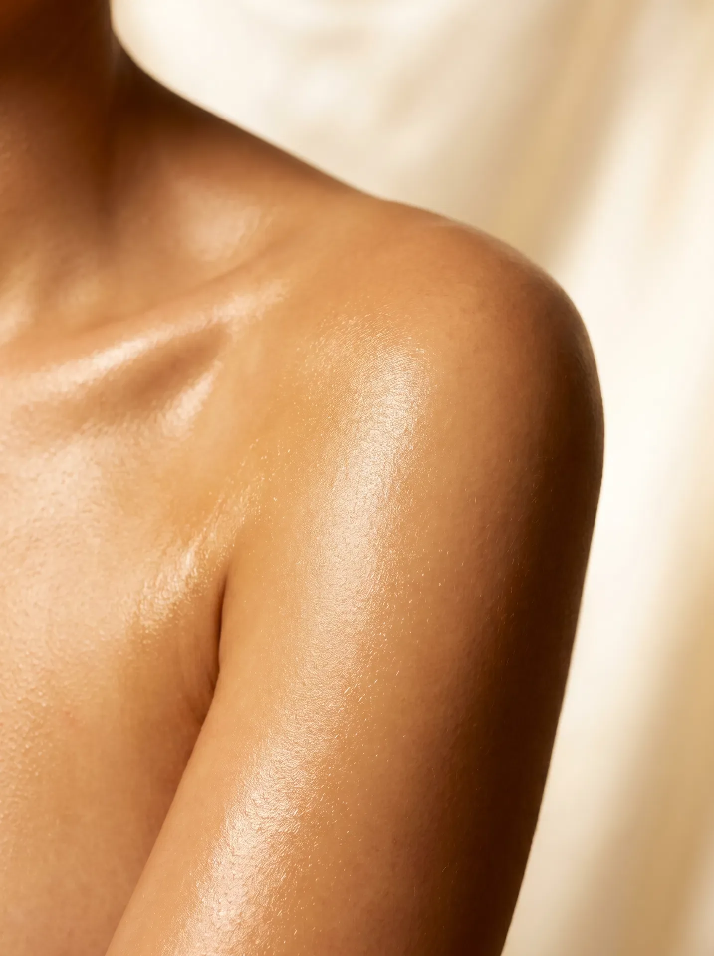 Glowing oiled skin after Korean-inspired body scrub with jojoba oil finish at Banyan & Bamboo Austin