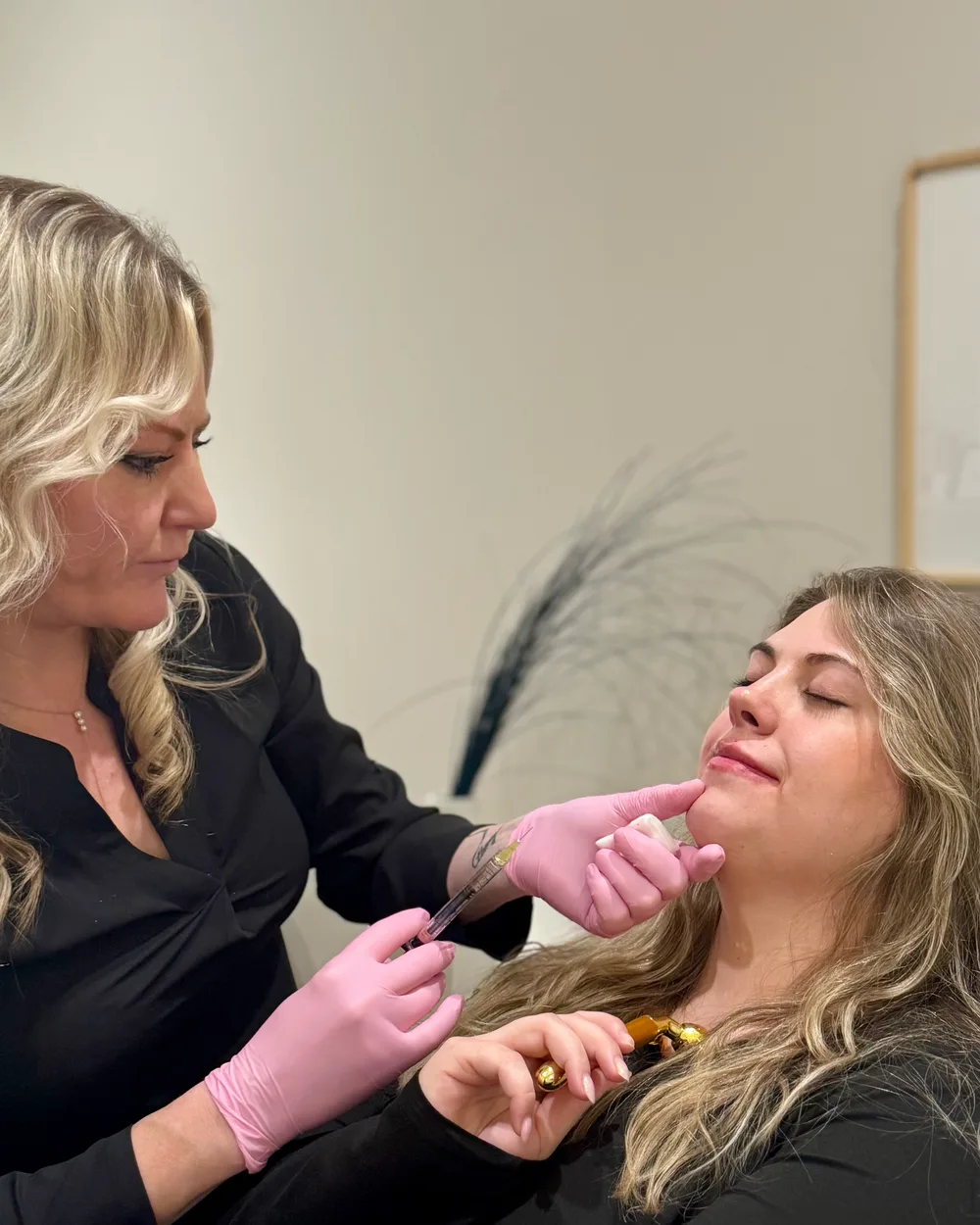Brittany Cantu, AME placing lip filler for a patient at Banyan and Bamboo in South Austin, TX